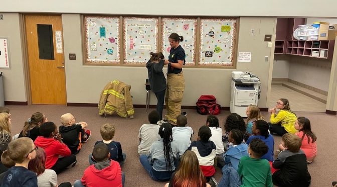 LBFD member speaking with local community members